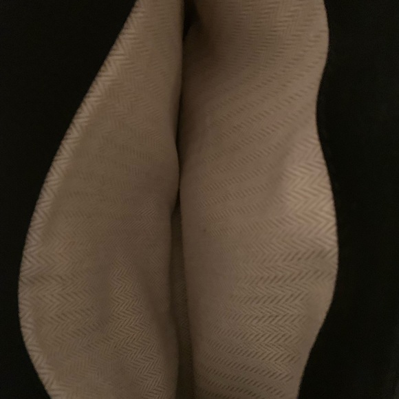 Tory Burch—100% leather. This bag has lots of room, three pockets. - Picture 10 of 10